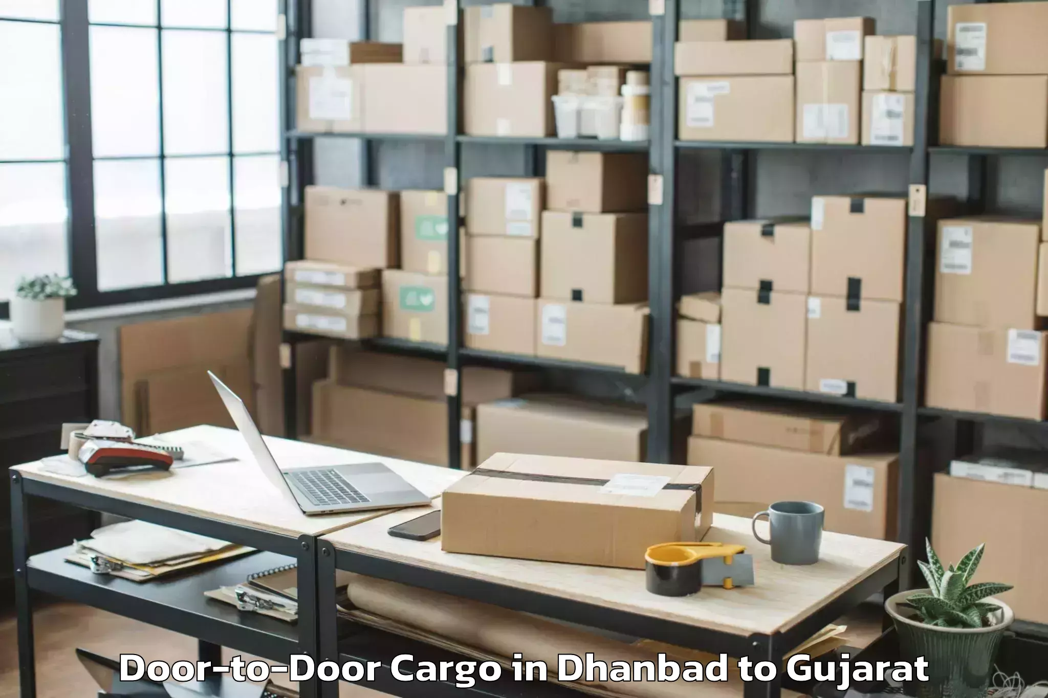 Leading Dhanbad to Keshod Airport Ixk Door To Door Cargo Provider